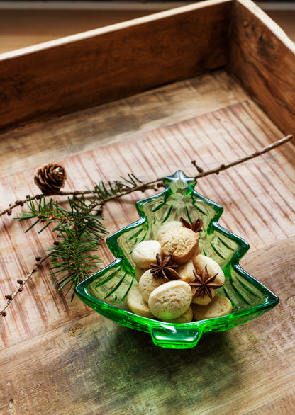 Madam Stoltz Christmas Tree Glass Bowl filled with butter cookies and star anise on a rustic wooden tray with a pine branch