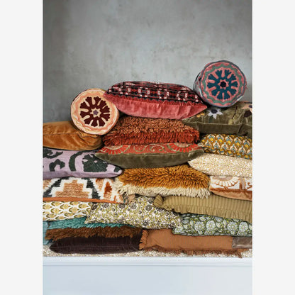 Madam Stoltz Velvet Cushion Cover stack with various colors, patterns, and textures like fringes and embroidery.