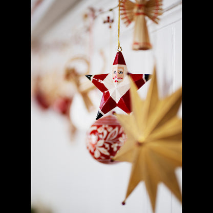 Hand-Painted Santa Star by Madam Stoltz, a red and white star-shaped ornament depicting Santa&