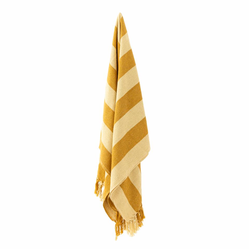 Bloomingville Frello Throw, Yellow, a cozy blanket with bold yellow and beige stripes and decorative tassels, hanging folded.