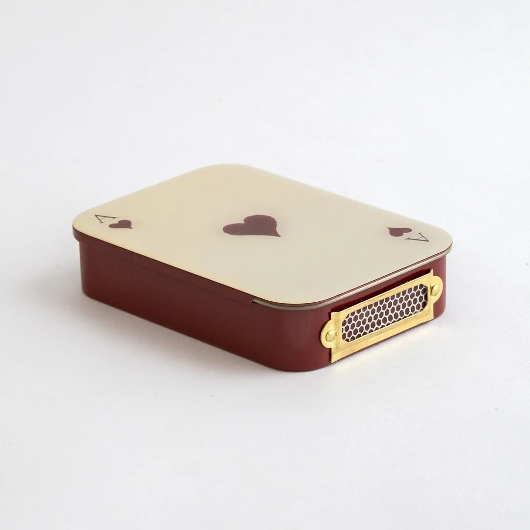 Roomytown Matches in Tin, a red and cream tin designed like an Ace of Hearts playing card with a brass striker.