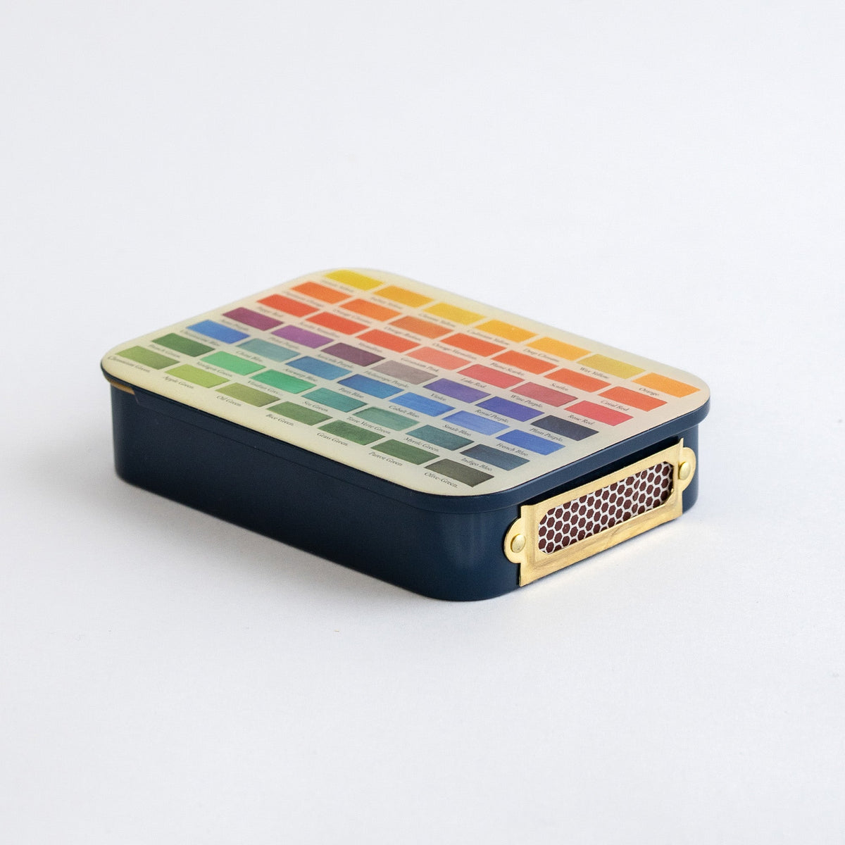 Roomytown Matches in Tin, dark blue with a color palette lid and brass striker, on a white background.