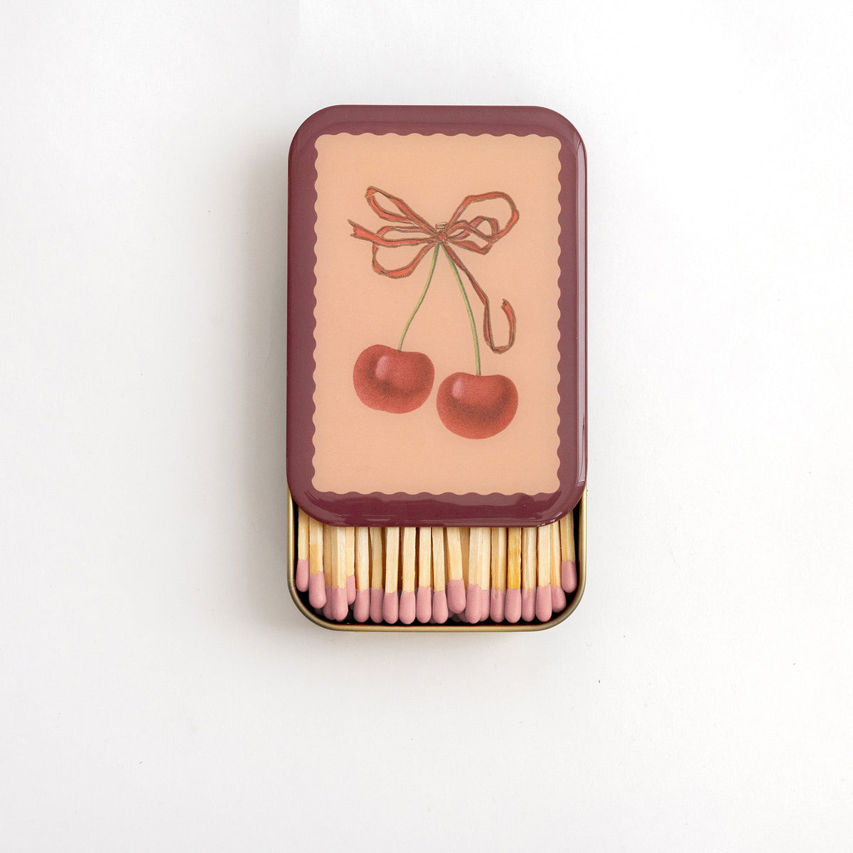 Roomytown Matches in Tin with cherry design lid, open to reveal pink-tipped matches.