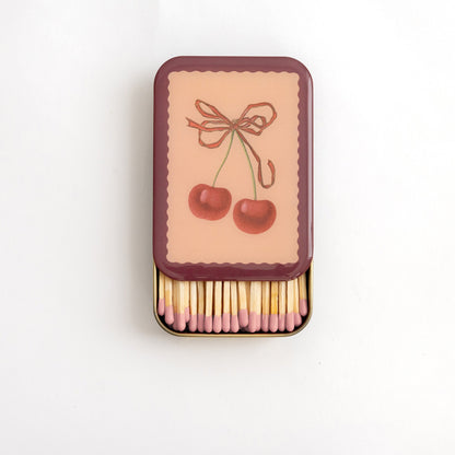 Roomytown Matches in Tin with cherry design lid, open to reveal pink-tipped matches.