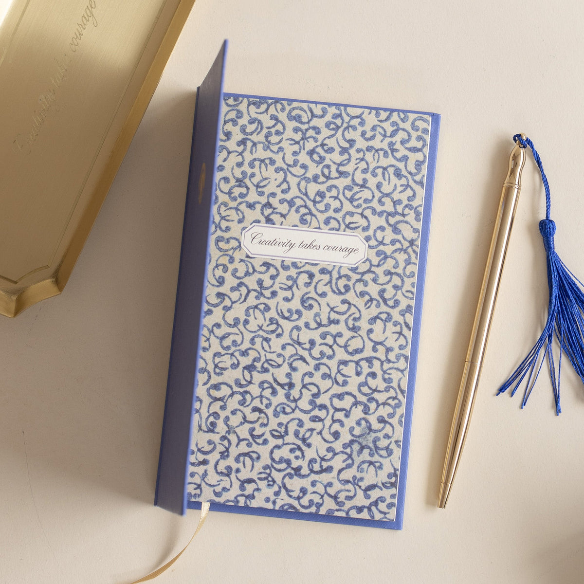 Roomytown Slim Lined Notebook with blue and white swirl pattern, &